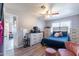 Bedroom with ceiling fan, dressers and closet, perfect for personal retreat or overnight guests at 2022 W Aster Dr, Phoenix, AZ 85029