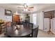 Inviting dining room with a large table, wooden chairs, and view of the kitchen at 2022 W Aster Dr, Phoenix, AZ 85029