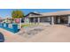 Charming single-story home featuring a covered porch and well-maintained front yard at 2022 W Aster Dr, Phoenix, AZ 85029