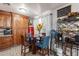 Cozy kitchenette featuring wood cabinets, a small dining table, and stylish decorations at 2022 W Aster Dr, Phoenix, AZ 85029