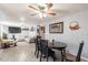 Open-concept living and dining area with tile floors and ample natural light at 2022 W Aster Dr, Phoenix, AZ 85029