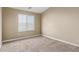 Cozy bedroom with neutral carpet, a window for natural light, and a blank canvas for personalization at 240 W Juniper Ave # 1211, Gilbert, AZ 85233