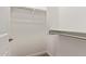 Walk-in closet featuring wire shelving and ample storage space for organization at 240 W Juniper Ave # 1211, Gilbert, AZ 85233