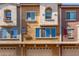 Townhome exterior showing multi-colored facade with garage at 240 W Juniper Ave # 1211, Gilbert, AZ 85233