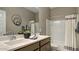 Bright bathroom features double sinks, a framed mirror, and a shower/tub combination at 24066 W Cocopah St, Buckeye, AZ 85326