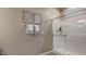 Shower with glass door, modern fixtures, and towel rack for a clean and functional space at 24066 W Cocopah St, Buckeye, AZ 85326