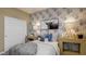 Charming bedroom features a bed, end tables, and a decorative monochrome wall covering at 24066 W Cocopah St, Buckeye, AZ 85326