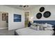 Well decorated bedroom featuring a comfortable bed, decorative art, and bright interior paint at 24066 W Cocopah St, Buckeye, AZ 85326