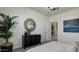 Bedroom with carpet and a black dresser, contrasting walls, and an eye-catching wall mirror at 24066 W Cocopah St, Buckeye, AZ 85326