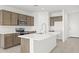 Bright kitchen with an island, modern stainless-steel appliances and plenty of cabinet space at 24066 W Cocopah St, Buckeye, AZ 85326