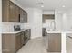 Bright kitchen with stainless steel appliances, a spacious island, and a pantry at 24066 W Cocopah St, Buckeye, AZ 85326