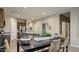Inviting kitchen and dining area boasts stainless steel appliances and an island with seating at 24066 W Cocopah St, Buckeye, AZ 85326