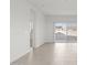Bright, open living room with tiled floors and sliding glass doors to the backyard at 24066 W Cocopah St, Buckeye, AZ 85326