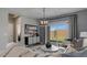 Cozy living area features a large sliding glass door and stylish furnishings at 24066 W Cocopah St, Buckeye, AZ 85326