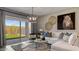 Inviting living room with ample natural light, stylish decor, and a view of the backyard at 24066 W Cocopah St, Buckeye, AZ 85326