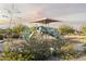 Playground featuring slides, a climbing wall, and shade structure in community park at 24066 W Cocopah St, Buckeye, AZ 85326