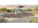 Playground with slides, climbing area and benches in landscaped community park at 24066 W Cocopah St, Buckeye, AZ 85326