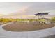 Community playground features shaded play equipment and easy access sidewalks at 24066 W Cocopah St, Buckeye, AZ 85326