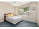 Bedroom with a window providing natural light and a ceiling fan at 2442 N 22Nd Ave, Phoenix, AZ 85009