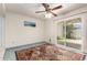 Cozy bedroom with sliding door, blue carpet, a ceiling fan and serene space for relaxation and rejuvenation at 2442 N 22Nd Ave, Phoenix, AZ 85009