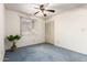 Serene bedroom with a closet, blue carpet and a window offering natural light for a peaceful retreat at 2442 N 22Nd Ave, Phoenix, AZ 85009