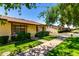 Charming single-story home featuring a well-manicured lawn, tidy landscaping and covered entry on a sunny day at 2442 N 22Nd Ave, Phoenix, AZ 85009
