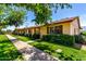 Inviting single-story home with neatly trimmed front yard landscaping and a paved walkway on a bright, sunny day at 2442 N 22Nd Ave, Phoenix, AZ 85009