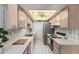 Practical kitchen featuring streamlined appliances, ample counter space and distinctive lighting for efficient cooking and dining at 2442 N 22Nd Ave, Phoenix, AZ 85009