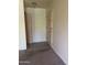 Neutral entryway featuring tile flooring and a closet for storage at 2530 W Berridge Ln # E111, Phoenix, AZ 85017