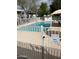 Community pool area, enclosed by a secure fence for resident privacy and safety at 2530 W Berridge Ln # E111, Phoenix, AZ 85017
