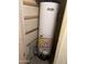 Utility closet showing a standard water heater, essential for home's hot water supply at 2530 W Berridge Ln # E111, Phoenix, AZ 85017