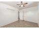 The bedroom provides ample space, tile flooring, and an additional closet for extra storage solutions at 2802 W Butler Dr, Phoenix, AZ 85051