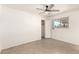 Cozy bedroom featuring tile flooring, ceiling fan, window, and closet for efficient storage at 2802 W Butler Dr, Phoenix, AZ 85051
