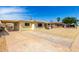 View of the house exterior and driveway featuring low maintenance gravel yard at 2802 W Butler Dr, Phoenix, AZ 85051