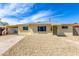 Charming single-story home featuring a gravel yard, neutral paint, and covered parking at 2802 W Butler Dr, Phoenix, AZ 85051