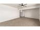 Bright living room featuring tile flooring and neutral walls with a ceiling fan at 2802 W Butler Dr, Phoenix, AZ 85051