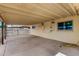 Spacious covered patio area with concrete flooring and access to the backyard at 2802 W Butler Dr, Phoenix, AZ 85051