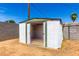 Backyard storage shed with open doors at 2802 W Butler Dr, Phoenix, AZ 85051
