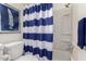 Bathroom showcasing a blue and white shower curtain, vanity, and wall art at 316 N Ironwood --, Mesa, AZ 85201