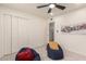 Bright bedroom with closet, ceiling fan, and comfortable beanbag chairs at 316 N Ironwood --, Mesa, AZ 85201
