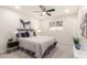 Bright bedroom with fan, comfortable queen bed, and neutral decor at 316 N Ironwood --, Mesa, AZ 85201