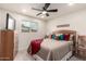 Inviting bedroom with a cozy bed, ceiling fan, and bright window at 316 N Ironwood --, Mesa, AZ 85201