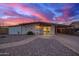 Charming home with a colorful sky, desert landscaping, and a convenient carport at 316 N Ironwood --, Mesa, AZ 85201