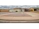 Single story home featuring low maintenance desert landscaping and a large, covered carport at 316 N Ironwood --, Mesa, AZ 85201