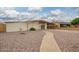 Single story home with desert landscaping, covered carport, and mature plantings at 316 N Ironwood --, Mesa, AZ 85201