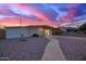 Lovely one-story house featuring low-maintenance landscaping and a charming walkway leading to the front door at 316 N Ironwood --, Mesa, AZ 85201