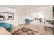 Hallway with stylish rugs, comfortable blue chairs, and office space at 316 N Ironwood --, Mesa, AZ 85201
