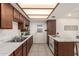 Cozy kitchen with marble countertops, wood cabinetry and bright lighting at 316 N Ironwood --, Mesa, AZ 85201
