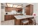 Charming kitchen featuring marble countertops, stainless microwave, tile floor, and breakfast bar at 316 N Ironwood --, Mesa, AZ 85201