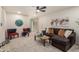 Bright living room featuring cozy seating, recessed lights, and neutral carpet at 316 N Ironwood --, Mesa, AZ 85201